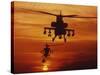 Four AH-64 Apache Anti-armor Helicopters Fly in Formation at Dusk-Stocktrek Images-Stretched Canvas