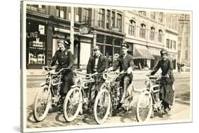 Four Bicyclists Downtown-null-Stretched Canvas