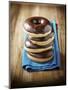 Four Doughnuts with Chocolate Glaze, Stacked-Michael Löffler-Mounted Photographic Print
