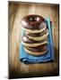 Four Doughnuts with Chocolate Glaze, Stacked-Michael Löffler-Mounted Photographic Print