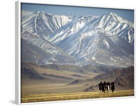 Four Eagle Hunters in Tolbo Sum, Golden Eagle Festival, Mongolia-Amos Nachoum-Framed Photographic Print