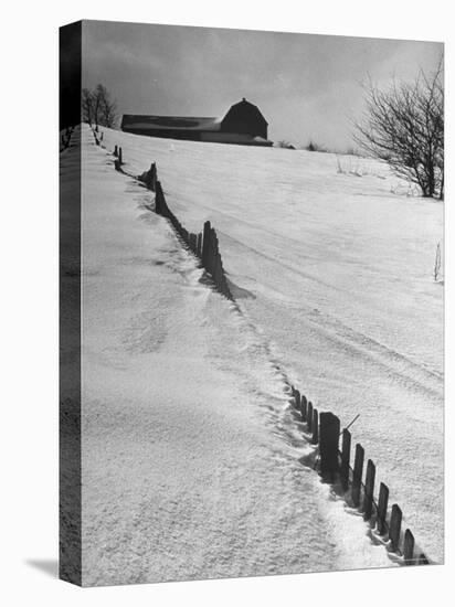 Four Ft. of Snow Almost Covering Up Snow Fence in Front of Barn on the Hill on Upstate Farm-Andreas Feininger-Stretched Canvas