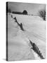 Four Ft. of Snow Almost Covering Up Snow Fence in Front of Barn on the Hill on Upstate Farm-Andreas Feininger-Stretched Canvas