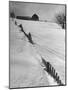 Four Ft. of Snow Almost Covering Up Snow Fence in Front of Barn on the Hill on Upstate Farm-Andreas Feininger-Mounted Photographic Print