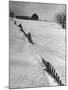 Four Ft. of Snow Almost Covering Up Snow Fence in Front of Barn on the Hill on Upstate Farm-Andreas Feininger-Mounted Photographic Print