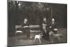 Four Men and Two Dogs in a Garden-null-Mounted Photographic Print