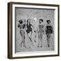 Four Models Showing Off the Latest Bathing Suit Fashions While Lying on a Sandy Florida Beach-Nina Leen-Framed Photographic Print