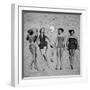 Four Models Showing Off the Latest Bathing Suit Fashions While Lying on a Sandy Florida Beach-Nina Leen-Framed Photographic Print