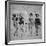 Four Models Showing Off the Latest Bathing Suit Fashions While Lying on a Sandy Florida Beach-Nina Leen-Framed Photographic Print