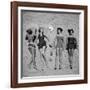 Four Models Showing Off the Latest Bathing Suit Fashions While Lying on a Sandy Florida Beach-Nina Leen-Framed Photographic Print