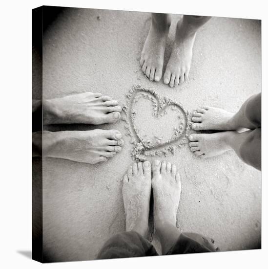 Four Pairs of Feet Standing around a Heart Shape Drawn in Sandy Beach, Taransay, Scotand, UK-Lee Frost-Stretched Canvas