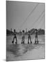 Four People Competing in the National Water Skiing Championship Tournament-Mark Kauffman-Mounted Photographic Print