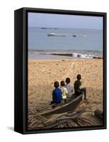 Four Small Boys Look Out to Sea from Where They Sit on Bamboo Fishing Boat on Island of Princip�-Camilla Watson-Framed Stretched Canvas