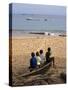 Four Small Boys Look Out to Sea from Where They Sit on Bamboo Fishing Boat on Island of Princip�-Camilla Watson-Stretched Canvas