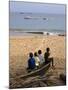 Four Small Boys Look Out to Sea from Where They Sit on Bamboo Fishing Boat on Island of Princip�-Camilla Watson-Mounted Photographic Print