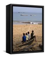 Four Small Boys Look Out to Sea from Where They Sit on Bamboo Fishing Boat on Island of Princip�-Camilla Watson-Framed Stretched Canvas