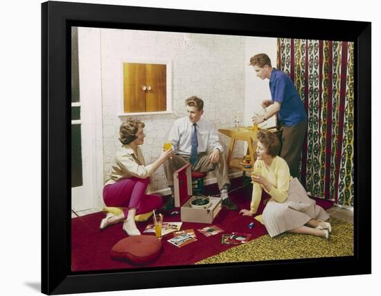 Four Smartly-Dressed Teenagers Having Cocktails around a Record Player-null-Framed Photographic Print