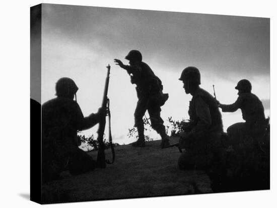 Four Soldiers with Helmets and Rifles Moving on Crest of Ridge, Patroling at Night-Michael Rougier-Stretched Canvas