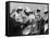 Four Young British Student Nurses Making Notes Together from Medical Textbooks-null-Framed Stretched Canvas