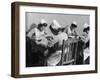 Four Young British Student Nurses Making Notes Together from Medical Textbooks-null-Framed Photographic Print