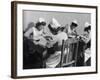 Four Young British Student Nurses Making Notes Together from Medical Textbooks-null-Framed Photographic Print