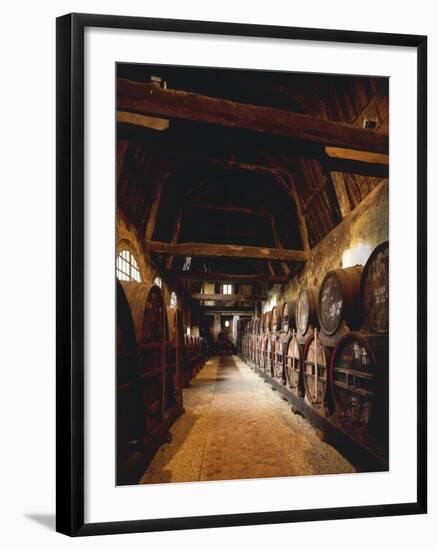 France, Chateau De Breuil-En-Auge, Ageing Calvados Barrels in Old Stables-null-Framed Giclee Print