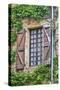 France, Cordes-sur-Ciel. Weathered shutters and window.-Hollice Looney-Stretched Canvas