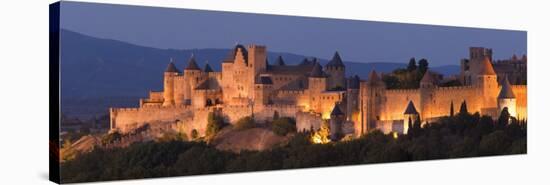 France, Languedoc-Rousillon, Carcassonne; the Fortifications of Carcassonne at Dusk-Katie Garrod-Stretched Canvas