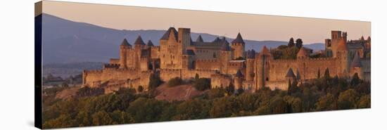 France, Languedoc-Rousillon, Carcassonne; the Fortifications of Carcassonne at Dusk-Katie Garrod-Stretched Canvas