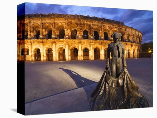 France, Provence, Nimes, Roman Ampitheatre, Toreador Statue at Dusk-Shaun Egan-Stretched Canvas