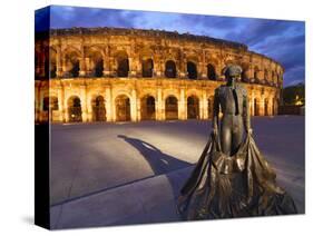 France, Provence, Nimes, Roman Ampitheatre, Toreador Statue at Dusk-Shaun Egan-Stretched Canvas