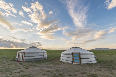Mongolian nomadic traditional gers and clouds in the sky, Middle Gobi province, Mongolia, Central A