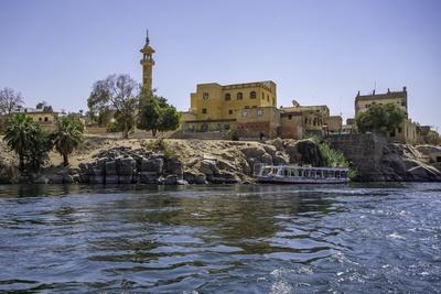 View of architecture on the Nile river from small boat in Aswan, Aswan ...