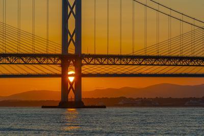 View of the Forth Road Bridge and Queensferry Crossing over the Firth of Forth at sunset