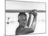 Freckled Surfer Larry Shaw Carrying Surfboard on His Head-Allan Grant-Mounted Photographic Print