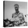 Freed American Pow Holding Red Cross Supplies after His Release from a Japanese Prison Camp-Carl Mydans-Stretched Canvas