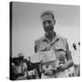 Freed American Pow Holding Red Cross Supplies after His Release from a Japanese Prison Camp-Carl Mydans-Stretched Canvas