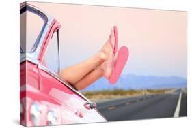 Freedom Car Travel Concept - Woman Relaxing with Feet out of Window in Cool Convertible Vintage Car-Maridav-Stretched Canvas