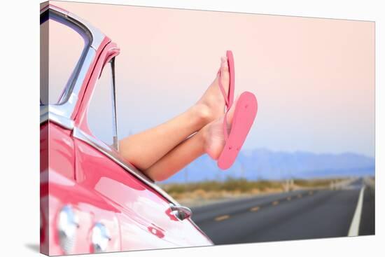 Freedom Car Travel Concept - Woman Relaxing with Feet out of Window in Cool Convertible Vintage Car-Maridav-Stretched Canvas