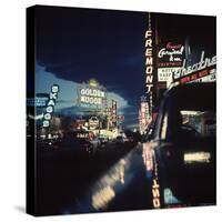 Fremont Street at Night Lit Up by Gambling Casino Neon Signs-Nat Farbman-Stretched Canvas