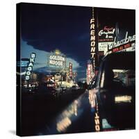 Fremont Street at Night Lit Up by Gambling Casino Neon Signs-Nat Farbman-Stretched Canvas