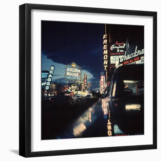 Fremont Street at Night Lit Up by Gambling Casino Neon Signs-Nat Farbman-Framed Premium Photographic Print