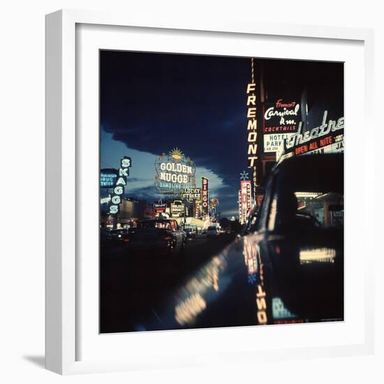 Fremont Street at Night Lit Up by Gambling Casino Neon Signs-Nat Farbman-Framed Photographic Print