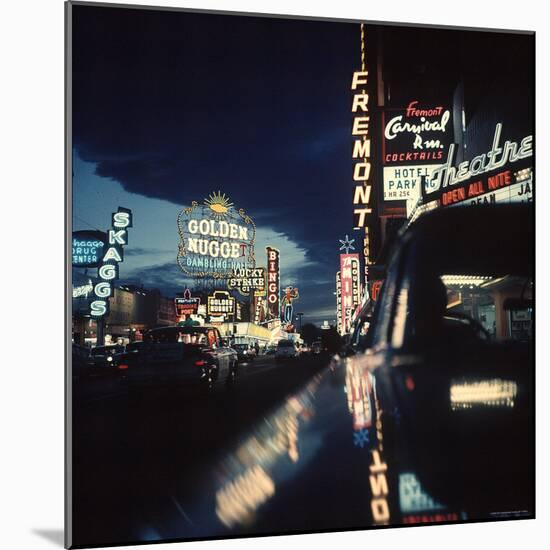 Fremont Street at Night Lit Up by Gambling Casino Neon Signs-Nat Farbman-Mounted Photographic Print