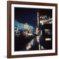 Fremont Street at Night Lit Up by Gambling Casino Neon Signs-Nat Farbman-Framed Photographic Print