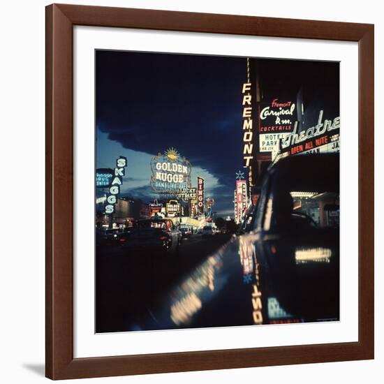 Fremont Street at Night Lit Up by Gambling Casino Neon Signs-Nat Farbman-Framed Photographic Print