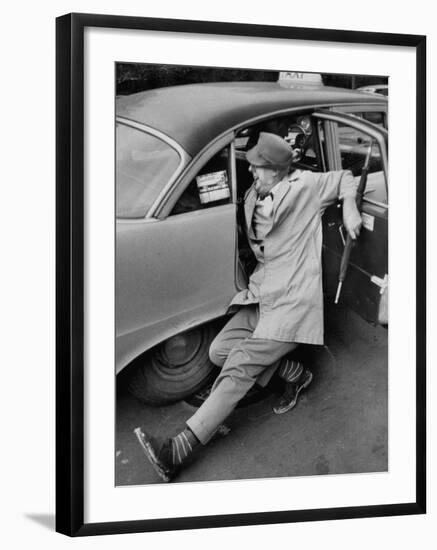 French Actor Jacques Tati Comically Getting Out of a Cab-Yale Joel-Framed Premium Photographic Print