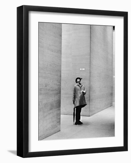 French Actor Jacques Tati Looking at the High Ceiling of an Office Lobby-Yale Joel-Framed Premium Photographic Print