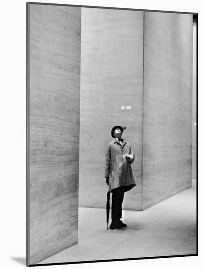 French Actor Jacques Tati Looking at the High Ceiling of an Office Lobby-Yale Joel-Mounted Premium Photographic Print