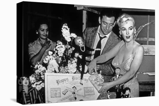 French Actor Yves Montand, American Actress Marilyn Monroe and a Birthday Cake-null-Stretched Canvas